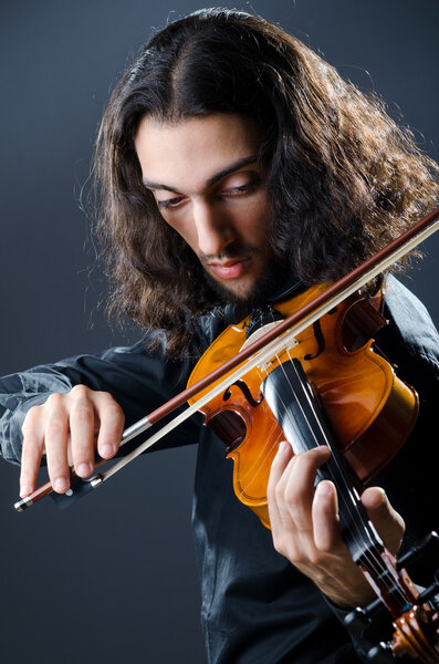 Young violin player playing