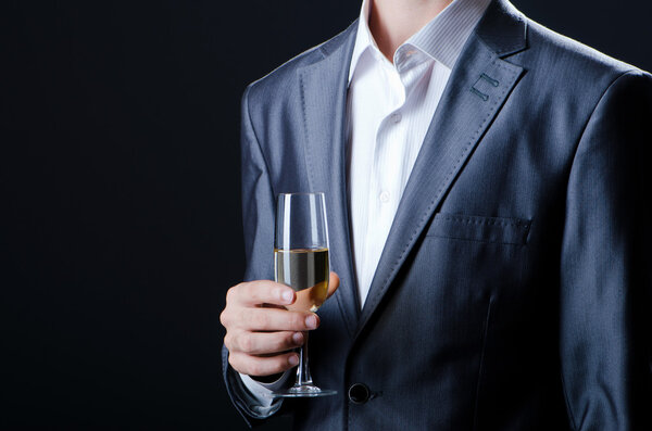 Man tasting wine in glass