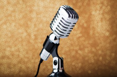 Old vintage microphone on background clipart