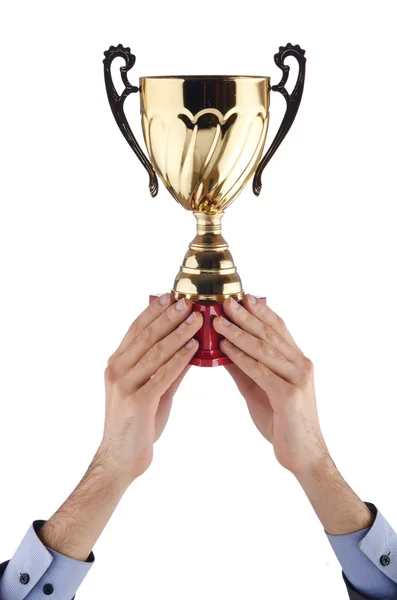 Hands with winners cup on white — Stock Photo, Image