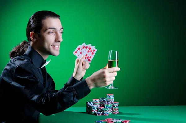 Player in casino and chips Royalty Free Stock Images