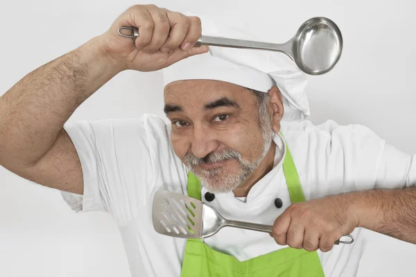 Attractive smiling chef with ladle — Stock Photo, Image