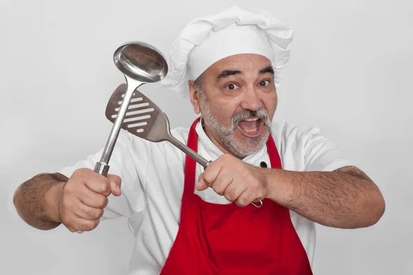 Attraktiver Koch mit Schöpfkelle — Stockfoto