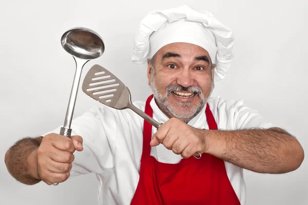 Attraktiver lächelnder Koch mit Schöpfkelle — Stockfoto