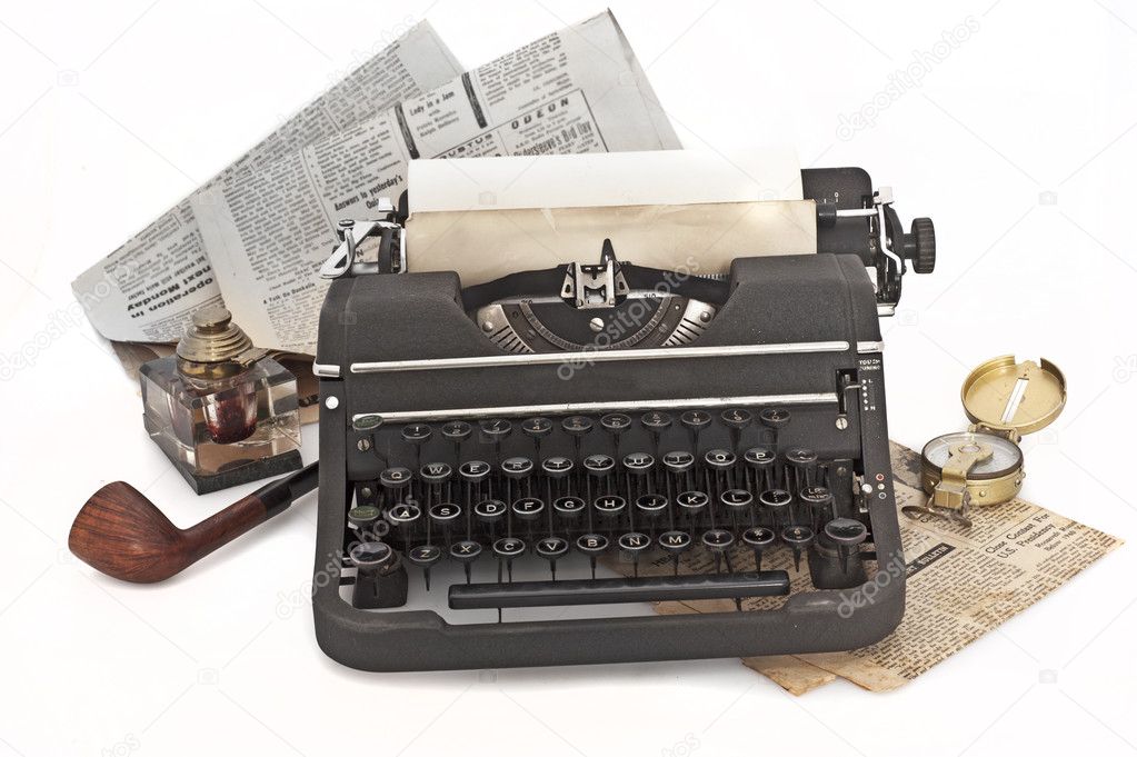 Vintage typewriter with paper and newspapers