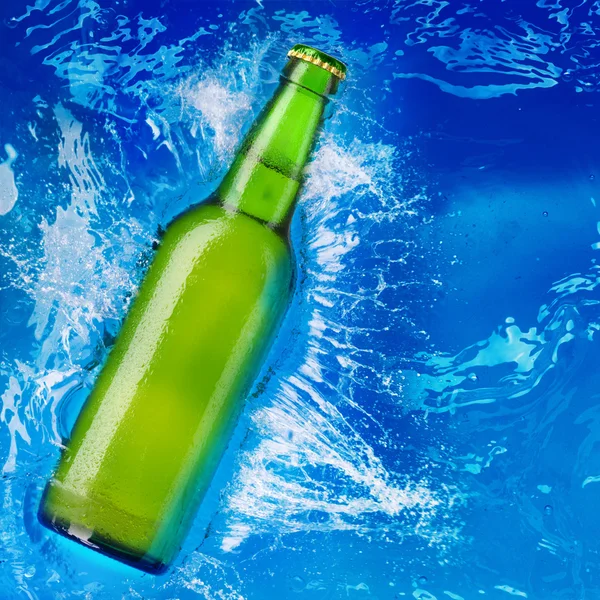 Beer bottle in water — Stock Photo © Irochka 1337643