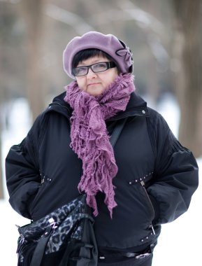 Portrait of woman against the backdrop of trees