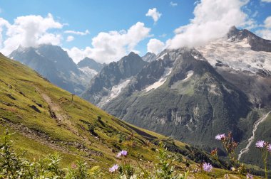 Summer view of high mountain Dombaj. Russia