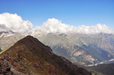 Summer view of high mountain Dombaj. Russia