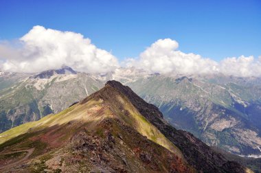 Summer view of high mountain Dombaj. Russia