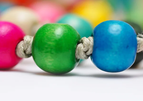 stock image Beautiful colorful beads on white background