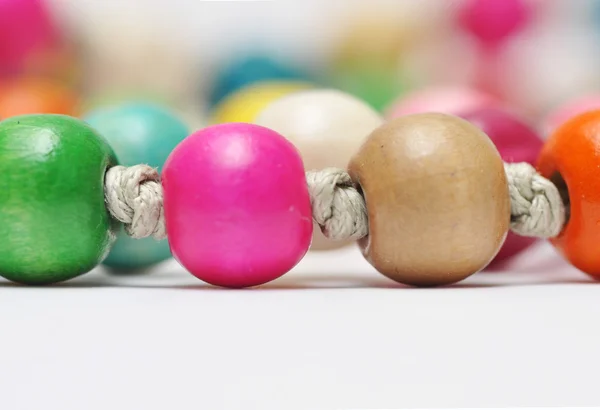 Stock image Beautiful colorful beads on white background