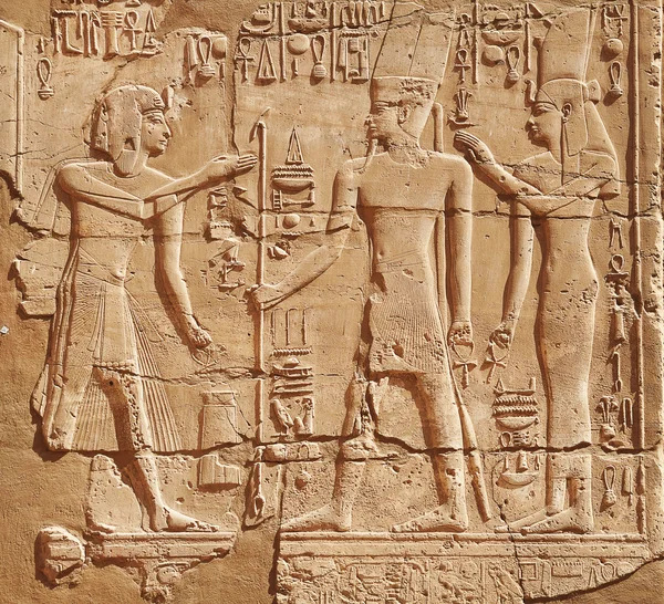 God and pharaon on the wall of Edfu temple, Egypt
