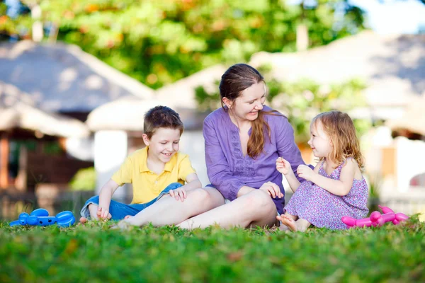 Mother and kids outdoors — Stock Photo, Image
