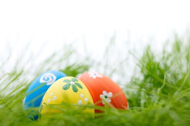 Easter eggs in grass clipart