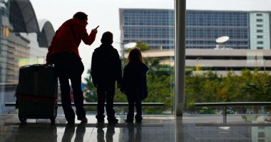 Family at airport clipart