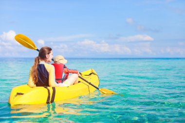 Mother and son kayaking clipart