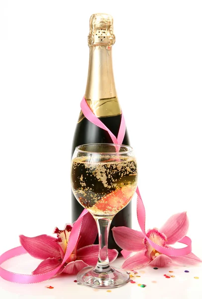Šampaňské a růžové orchideje — Stock fotografie