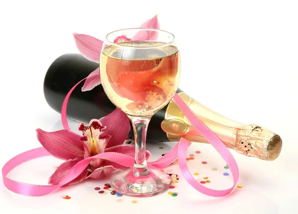 Шампанське і рожеві орхідеї — стокове фото