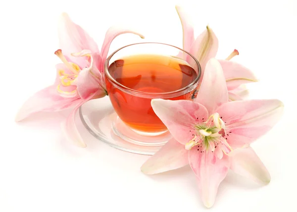 Tea and pink lily — Stock Photo, Image