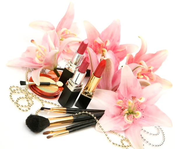 Decorative cosmetics and lilies — Stock Photo, Image
