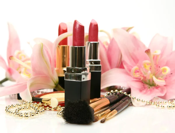 Decorative cosmetics and lilies — Stock Photo, Image