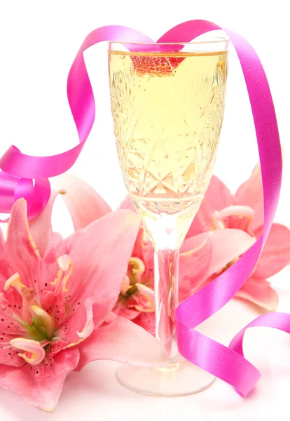 Pink lilies and champagne — Stock Photo, Image