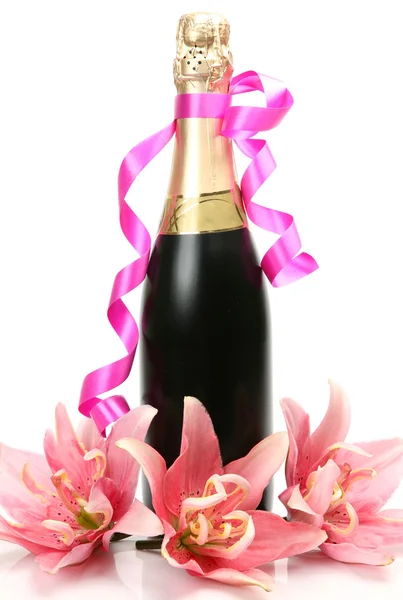 Pink lilies and champagne — Stock Photo, Image