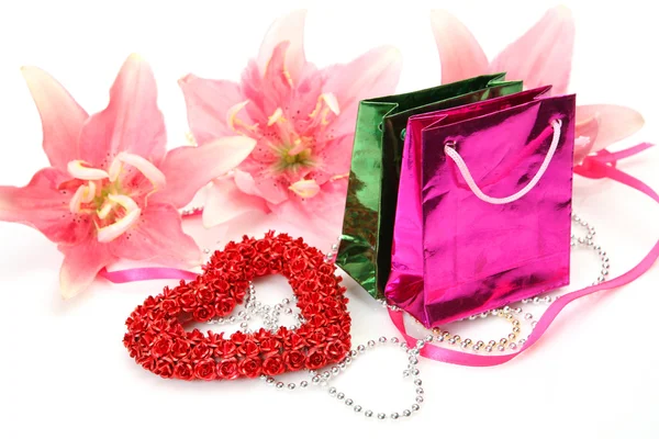 Pink lily and gift — Stock Photo, Image