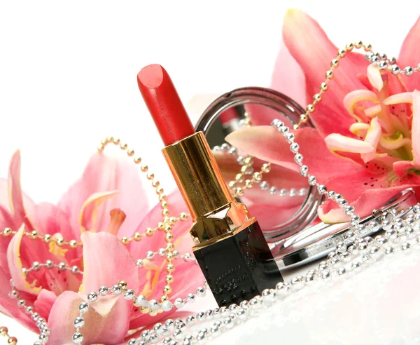 Decorative cosmetics and flowers — Stock Photo, Image