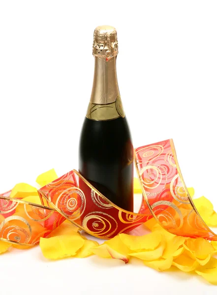 Champagne and petals of roses Stock Photo