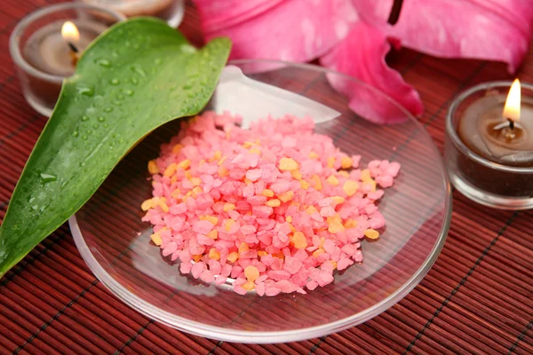 Pink lily and candles — Stock Photo, Image