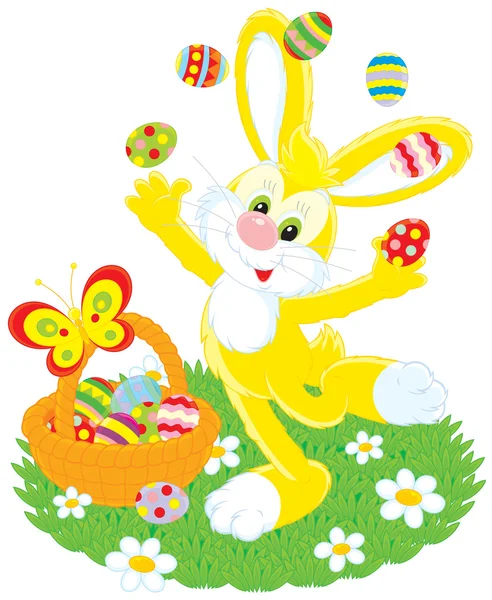 Conejo de Pascua malabares huevos pintados — Vector de stock