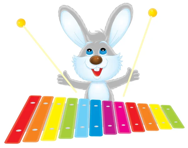 Kaninchen spielt ein Xylophon — Stockfoto