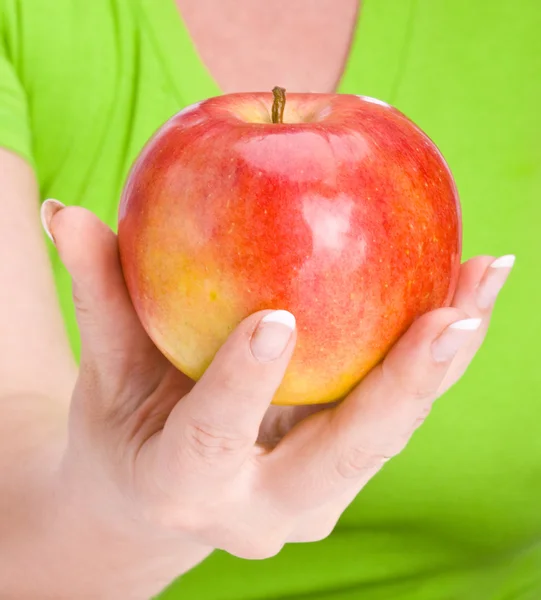 Jabłko w ręku — Zdjęcie stockowe