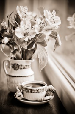 Sepia: Ceramic cup with coffee and bouquet of alstroemeria clipart