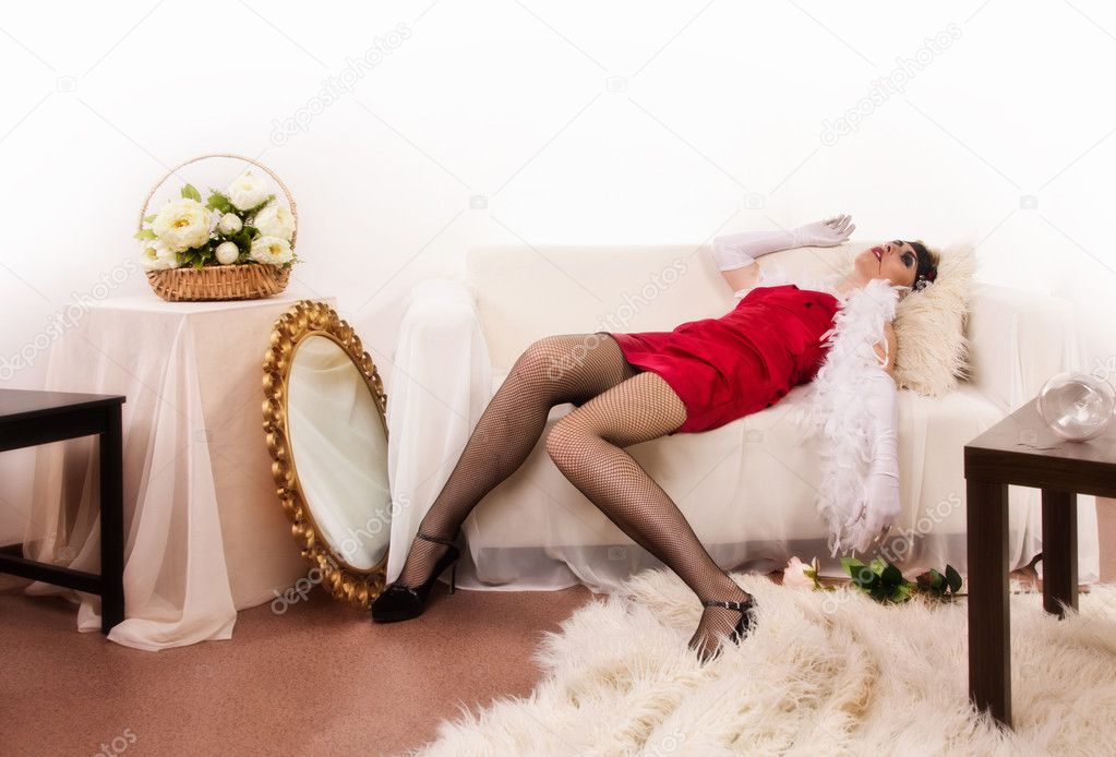 Lifeless woman lying on the sofa