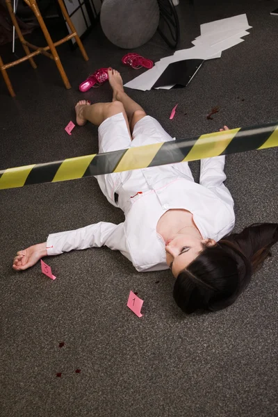 Nurse lying on the floor — Zdjęcie stockowe
