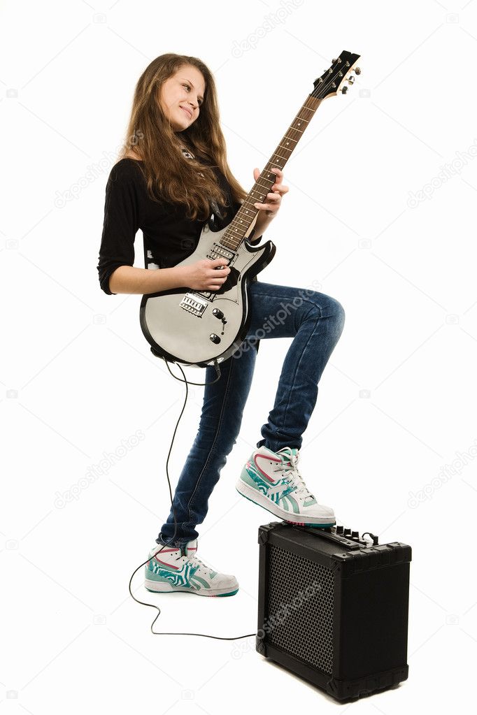 Teenager girl playing guitar