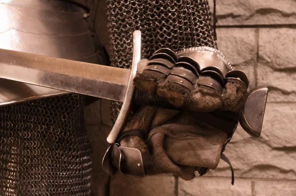 Sword in a hand of knight — Stock Photo, Image