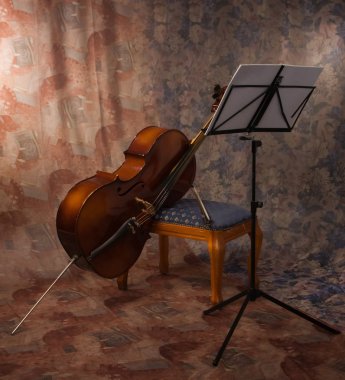 Old cello and music stand clipart