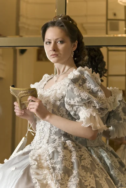 stock image Girl in ball gowns with a mask