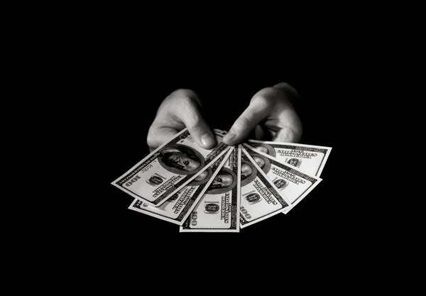 Hands with dollars over black — Stock Photo, Image