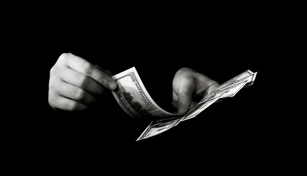 Hands with dollars over black — Stock Photo, Image