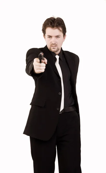 Επιχειρηματίας πυροβολεί ένα πυροβόλο όπλο — Φωτογραφία Αρχείου