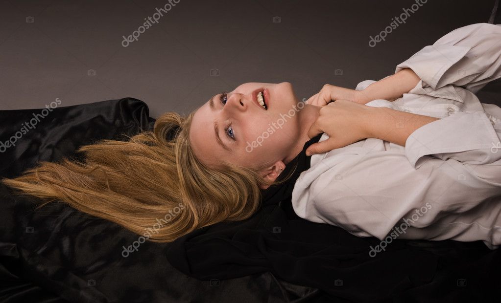 Sleeping on her breasts Stock Photo