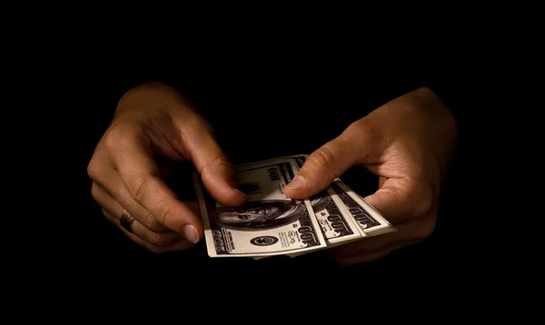Les mains des femmes avec des paquets de dollars — Photo