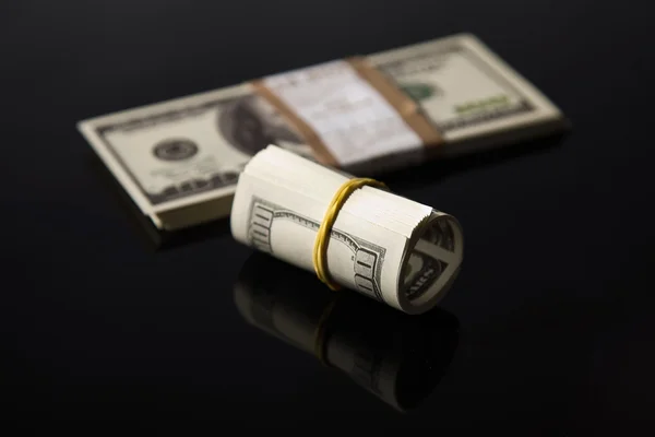 Dollars on a black background — Stock Photo, Image