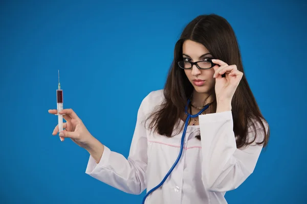 Young nurse with a syringe — Stock Photo, Image