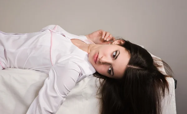 Lifeless nurse lying on the sofa — Stock Photo, Image